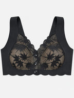Close-up of black floral lace and centre button details