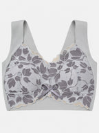 Light-coloured wide-strap bra shown from the back