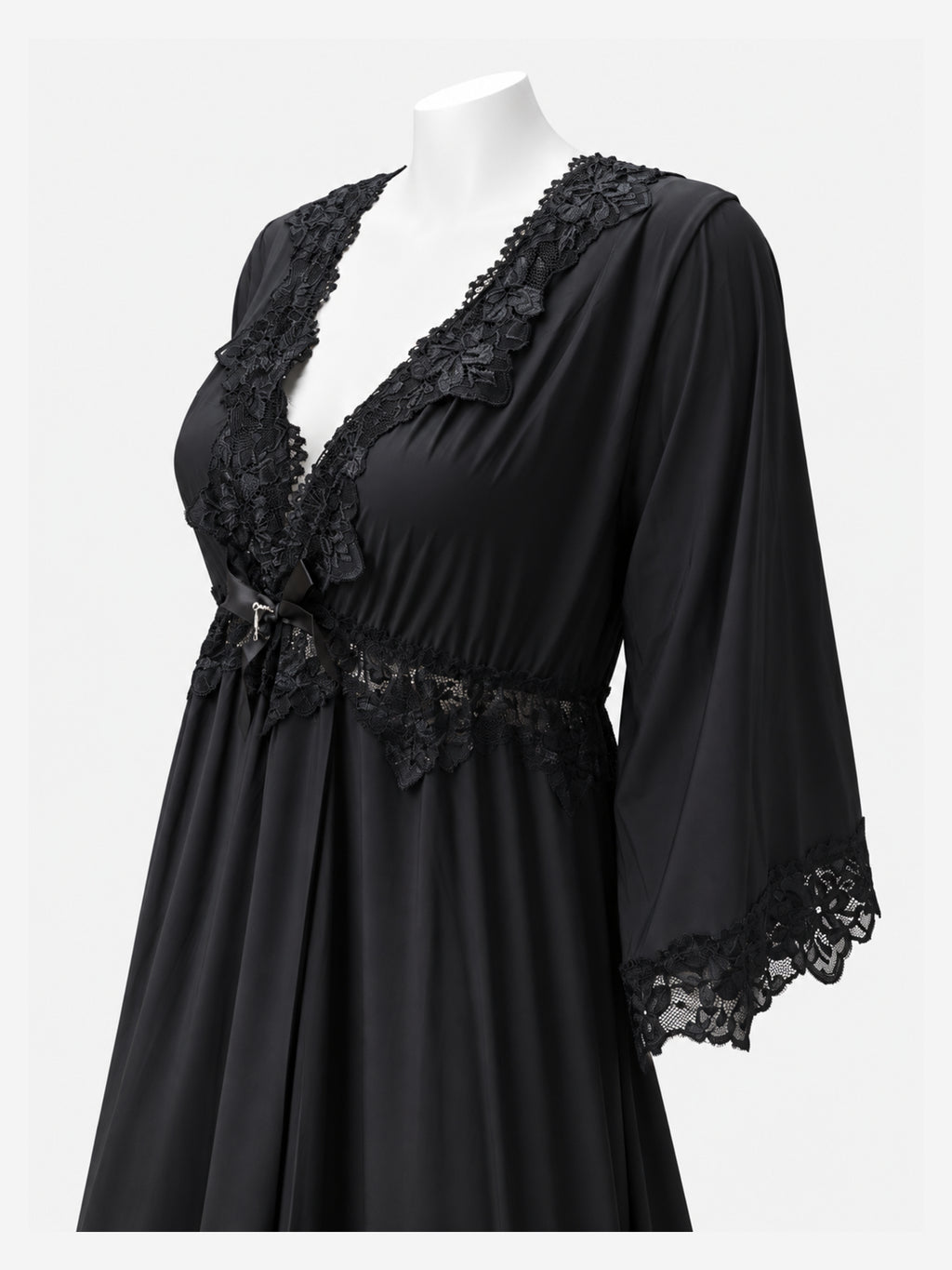 A black nightgown with floral lace trim on the V-neckline, waist, and three-quarter sleeves, displayed on a white mannequin torso against a light gray background.