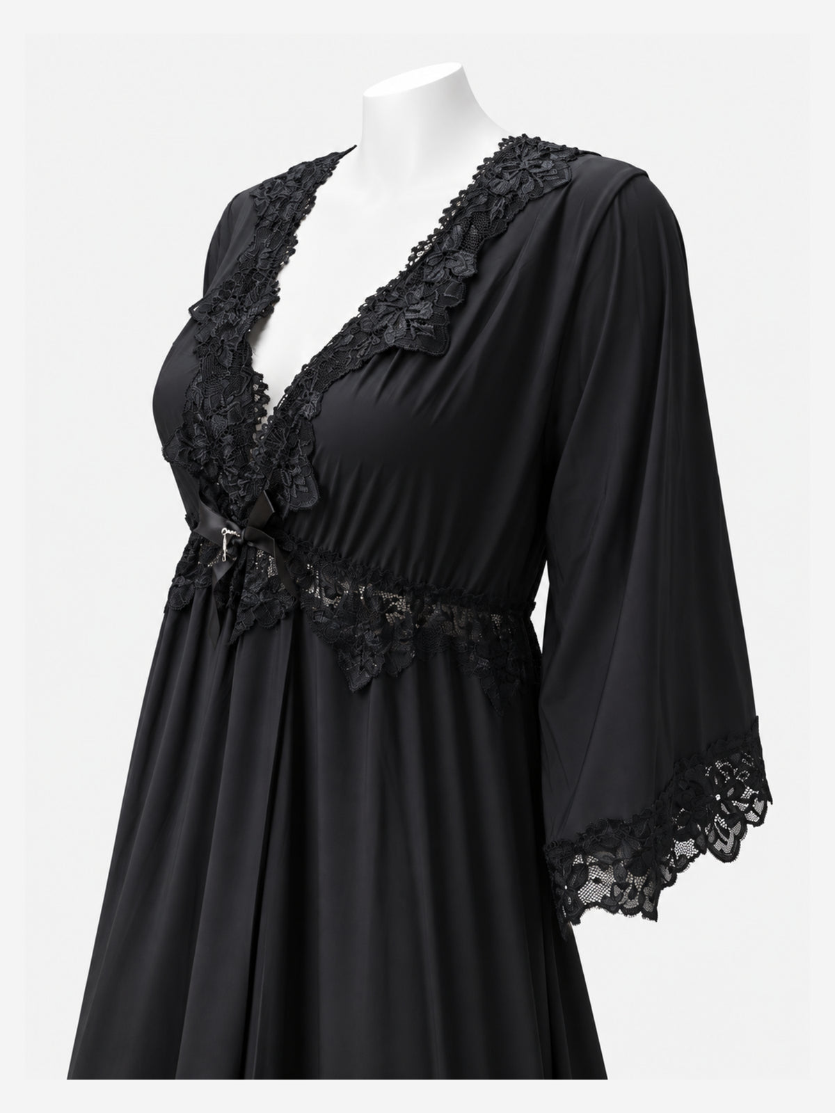 A black nightgown with floral lace trim on the V-neckline, waist, and three-quarter sleeves, displayed on a white mannequin torso against a light gray background.