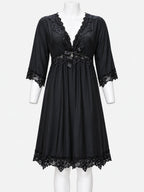 A black sheer nightgown with lace trim on the V-neckline, three-quarter sleeves, and hem, displayed on a white mannequin against a light gray background.