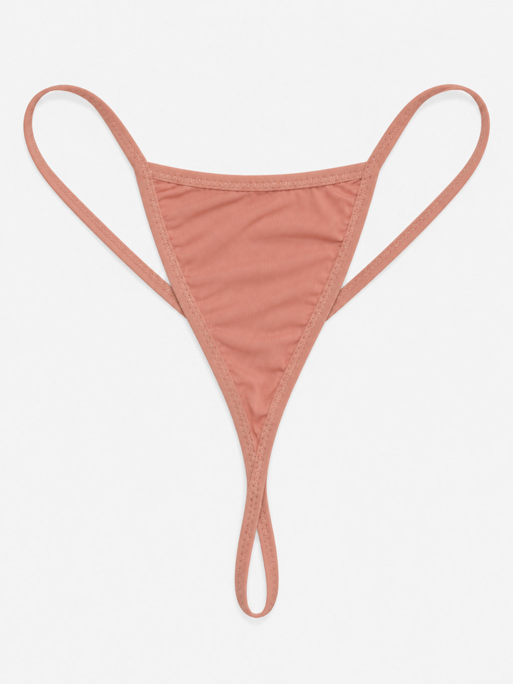 Close-up of peach nightdress neckline, shoulder bows and floral lace waist