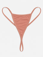 Close-up of peach nightdress neckline, shoulder bows and floral lace waist