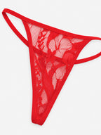 Matching red lace thong laid flat