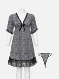 A black and white zebra-print babydoll nightgown with black lace trim and a small bow at the neckline, displayed on a white mannequin. A matching thong is shown to the right against a light gray background.