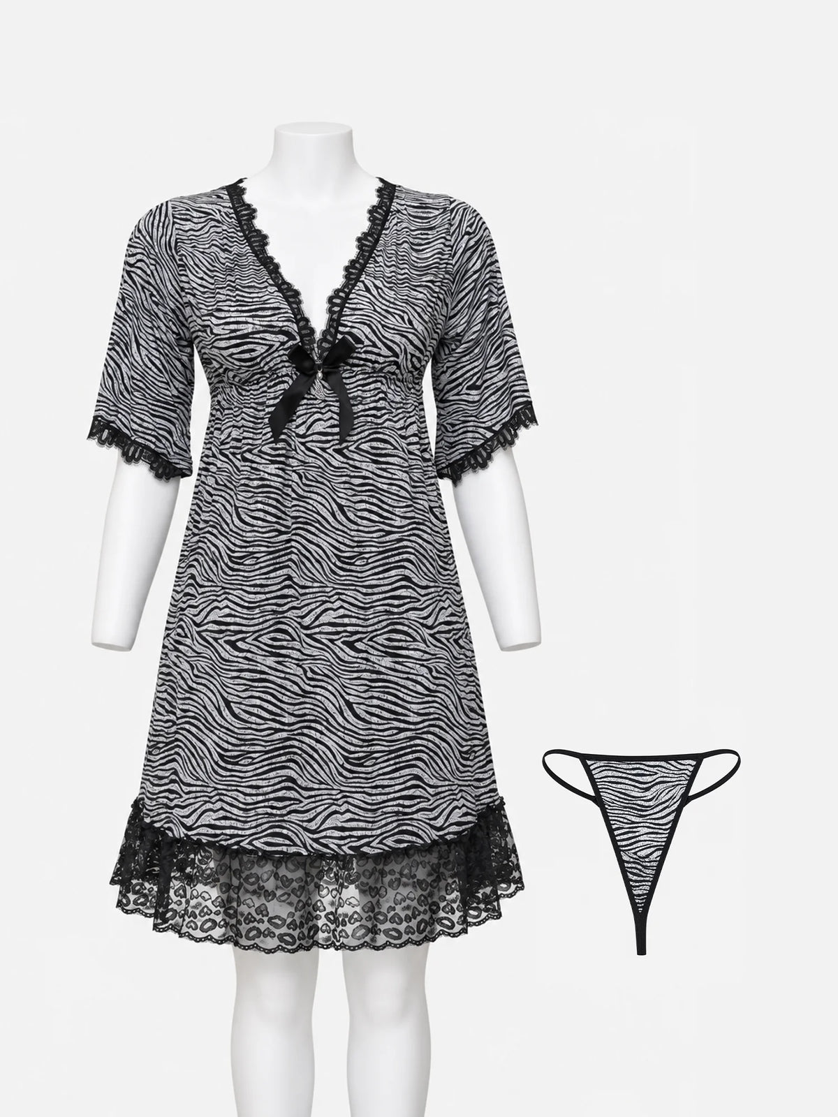 A black and white zebra-print babydoll nightgown with black lace trim and a small bow at the neckline, displayed on a white mannequin. A matching thong is shown to the right against a light gray background.