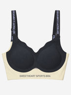 Black sweetheart sports bra with ribbed cups and printed straps, front view