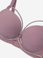 Close-up of mauve bra rhinestone and bow detail