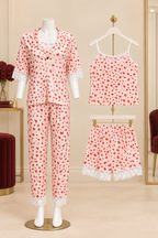 A women's three-piece pajama set displayed on a mannequin and hangers, featuring a red and white floral print with white lace trim details.