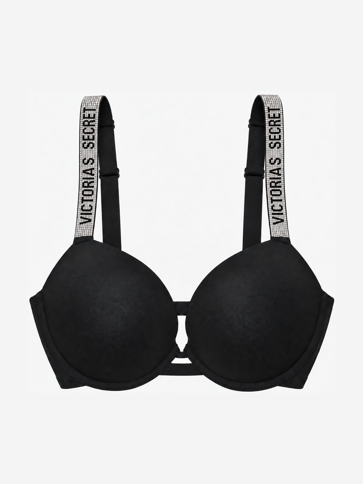 A black Victoria's Secret bra with wide, adjustable shoulder straps featuring the brand name 'VICTORIA'S SECRET' printed in white on a glittery silver background.